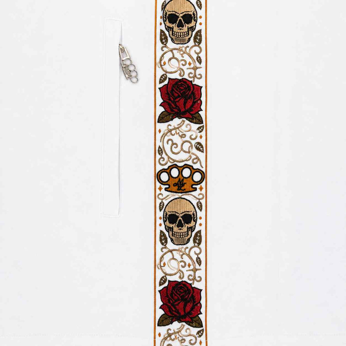 Close-up of the Calavera side band with skulls, red roses and MVL logo next to the zip