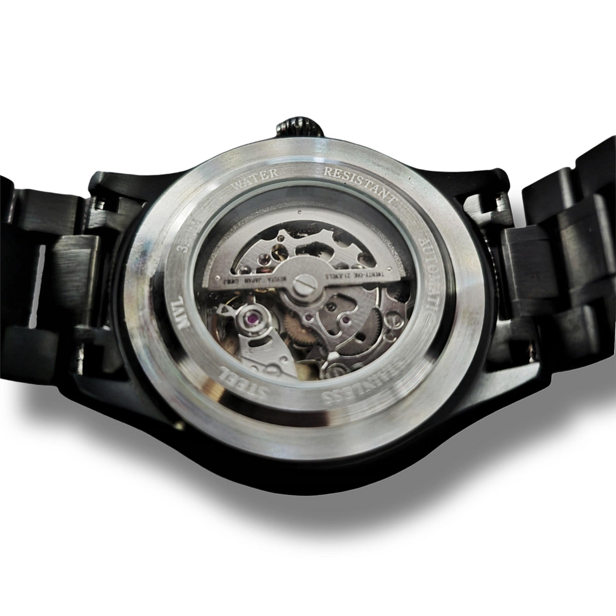 Back of the Double skull watch with glass case and visible automatic movement