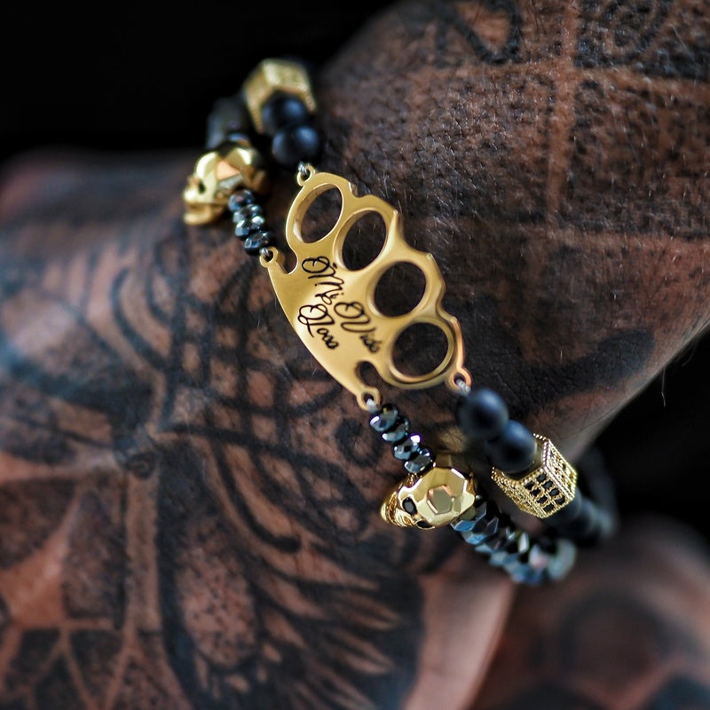 Pulsera MVL "Polygonal skulls" negra/dorada